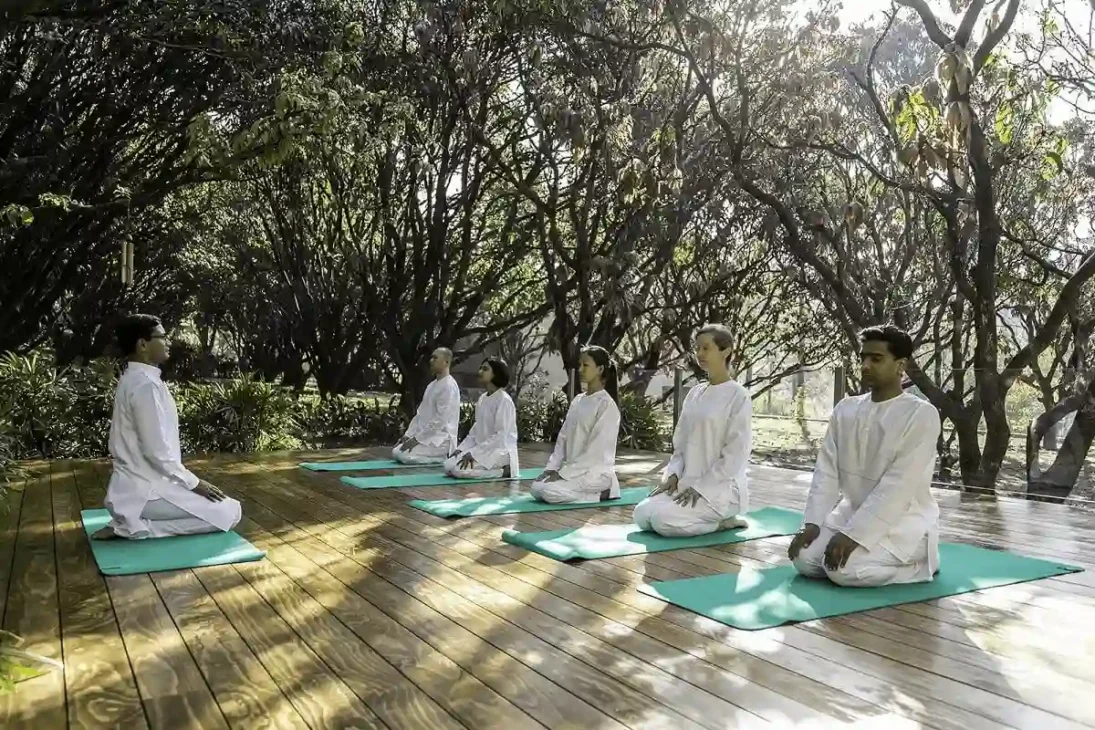 Person practicing yoga indoors, seated in a meditation pose