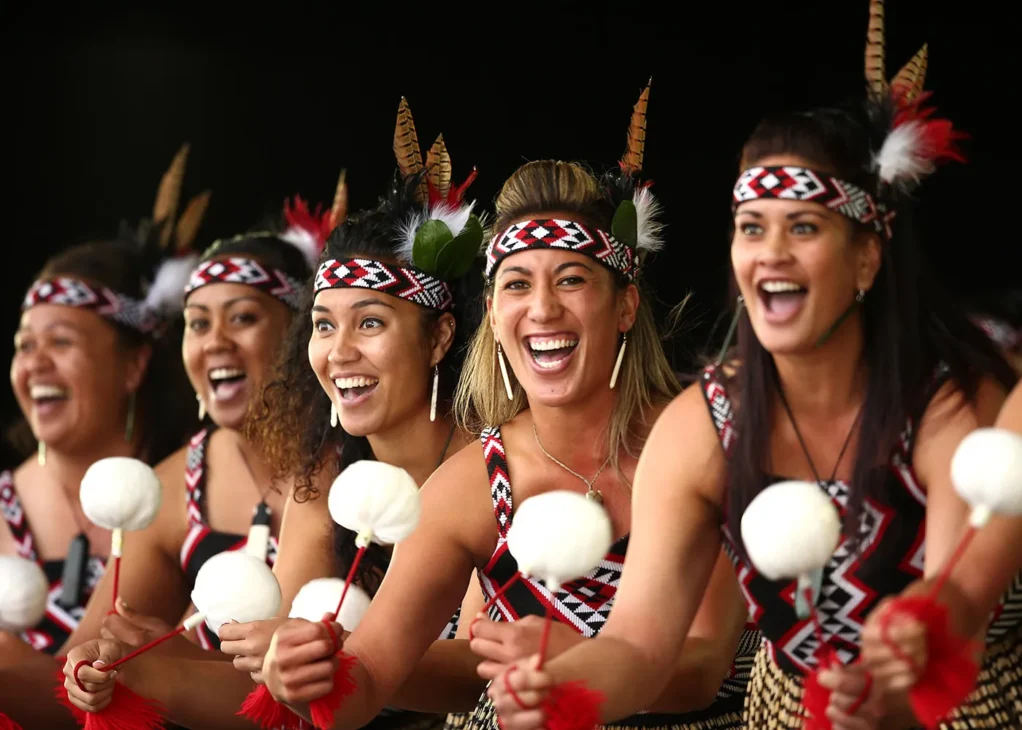 Group of New Zealander culture wearing traditional Māori costumes, celebrating Kiwi culture and national pride.