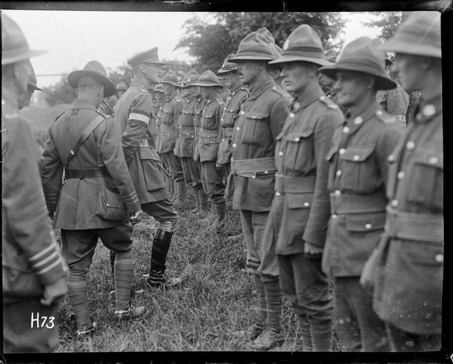 Vintage photograph of New Zealand soldiers wearing uniforms with kiwi insignias during World War I.